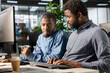 © DC Studio - General manager working closely with a team member on planning business tasks, setting company goals and aligning organizational strategies with measurable outcomes for sustainable growth.