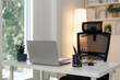 © Phimwilai - Modern home office setup featuring laptop and desk organizer