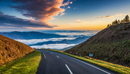 Wall Mural - A scenic asphalt road winds through lush green hills, offering breathtaking views of a sunrise over a sea of clouds and distant mountains.  The picturesque scene is serene and inspiring.
