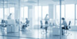 © Renderis - Blurred office interior with people working at desks seen through glass walls.