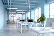 © Almarkha10 - Modern, minimalist office space with light blue walls, white desks, and chairs