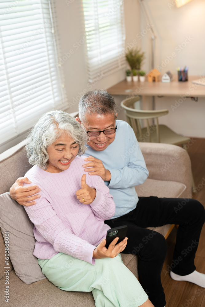 Senior couple, home and smile with smartphone for video call, mobile streaming and scroll on social media in retirement. Happy old man, woman and hug with phone for selfie, reading news app and relax