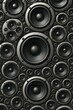 © Thomas Cody Stock - Collection of black speakers arranged in a dynamic pattern for audio enthusiasts and music lovers