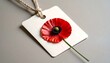 © Hura - Red poppy on a white tag