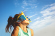 © vvvita - Little girl with big, funny sunglasses enjoys the sun. The girl against the blue sky on a sunny day. Summertime, Party, Travel concept