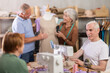© JackF - Group of elderly men and women sew and work with mannequin during master class