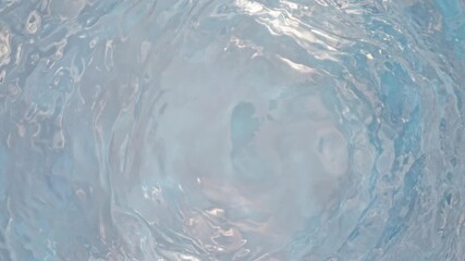 Wall Mural - super slow motion abstract shot of gently rippling light blue water background at 1000fps.