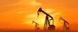 © Marta B - The silhouette of oil pumps against a vibrant orange sunset sky.