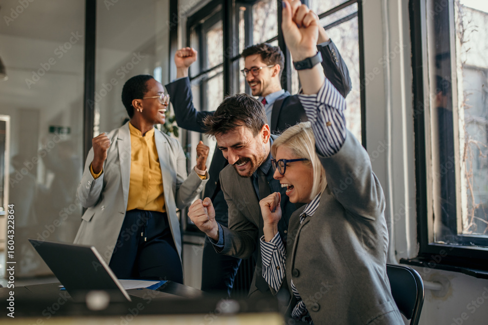 Excited business team celebrating success in the office Stock Photo ...
