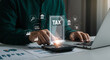 © Mei Studio - Calculating taxes using technology for financial planning and accounting