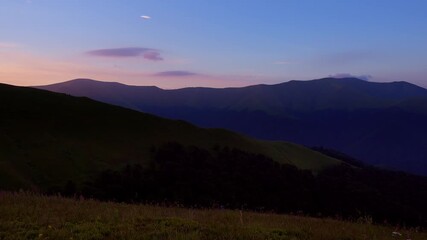 Wall Mural - Attractive evening landscape with red sunbeams in the sky.