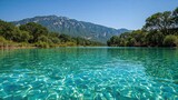 A canyon's pristine river with bright emerald green transparent waters in a protected park area