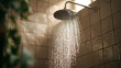 © cut - Low flow shower head spraying water in bathroom