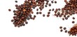 © Watcharong - Dark roasted coffee beans cascade onto ground coffee, white backdrop,  coffee,  stimulant