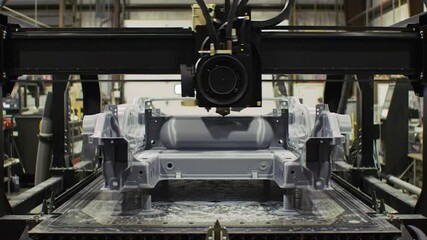 Industrial robotic 3D printer creating a part