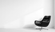 © Saowanee - Sleek black armchair against a stark white wall, furniture, elegant