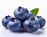 fresh juicy blueberries with vibrant purple color and tiny seeds on a white background