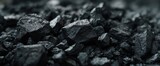 The intricate details of coal piled on a dark surface.