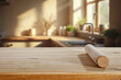 © magdal3na - Wooden rolling pin on kitchen table in warm cozy kitchen interior filled with natural soft daylight streaming through the window. Rustic charm of home baking and culinary preparation. Copy space.