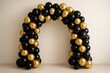 © Jelena - Luxurious black and gold balloon arch arrangement with metallic accents creating sophisticated party decoration for elegant celebrations