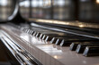 © Kate - Close-Up of Grand Piano Keyboard with Elegant Reflections
