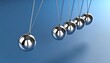 © Olga Gorkun - Newton's cradle illustrating the laws of motion and energy conservation, symbolizing cause and effect, decision-making or ripple effect in business or science