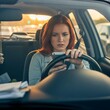© Lita - Woman distracted by a mobile phone while driving.