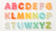 © DNA STUDIO - A playful and colorful arrangement of gummy alphabet letters from A to Z displayed in three rows Each letter is translucent and brightly colored creating a visually appealing educational display