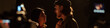 © TrueFrame Collective - Young adult Caucasian man and young adult Hispanic woman performing dramatic scene together during acting audition on stage with professional cameras recording their interaction