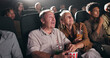 © peopleimages.com - Movie, theatre and senior couple with popcorn in cinema for entertainment, experience and watching film. Retirement, marriage and elderly man and woman with snacks for screening, premiere and film