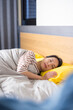 © leungchopan - Woman peacefully sleep on comfortable bed