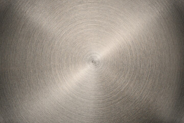 The bottom of a flat heating element of an electric kettle. Extreme close-up of the metal texture.