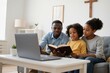 © filipobr - African family studying Bible together via online church platform