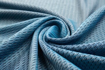 Close up of textured blue fabric with a swirling pattern