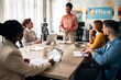 © Jelena - Professional Team Meeting in Modern Office Environment With Diverse Colleagues