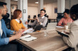 © Jelena - Business Team Engaged in a Collaborative Office Meeting