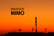 © Andrii - Image of 5G Massive MIMO Telecommunication tower at sunset. Cell Site Digital Cellular Telecommunication Tower Network Antenna and cranes on clear sunset orange sky background