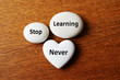 © designer rofiqul - White stones with motivational words on wooden surface heart round