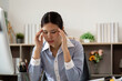 © Natee Meepian - Office Syndrome: Professional woman showing signs of stress at her computer