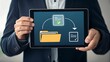 © CreativeEarth - Man holding digital tablet displaying file transfer from document to folder icon for collaboration and data management.