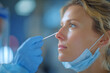 © Ann - Woman receiving medical test in clinic during day with healthcare professional wearing gloves and mask nearby