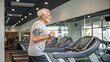 © Dahlia - Senior man with fitness tracker running on treadmill