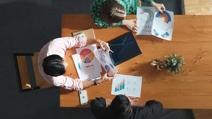 Wall Mural - top view of smart project manager holding document to presenting financial graph to caucasian invest