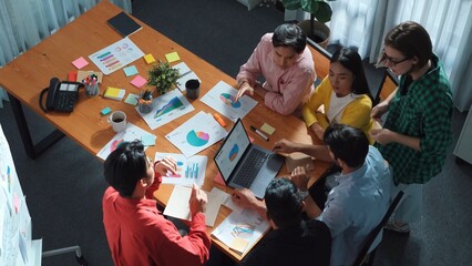 Wall Mural - group of skilled business people working together to analyze graph while project manager in casual c