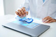 © NOSOX - Medical Professional Using Stylus on Holographic Heart Display – Futuristic Cardiology and Health Technology Concept