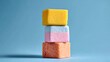 © Rashed - Stacked colorful cubes yellow blue pink orange textured blocks image
