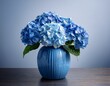 © Matt - blue hydrangea flower in a vase beautiful and luscious hydrangea flower bouquet in blue ceramic vase summer flower hydrangea in vase for interior decorations isolated