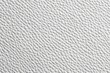 © Space Priest - Close-up of textured white leather surface with intricate pattern