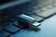 © Ramjan - A close up view of a usb drive resting on a laptop keyboard with a blurred background aesthetic shot
