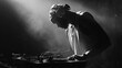 © Zidan - Silhouette of a DJ Performing at a Concert